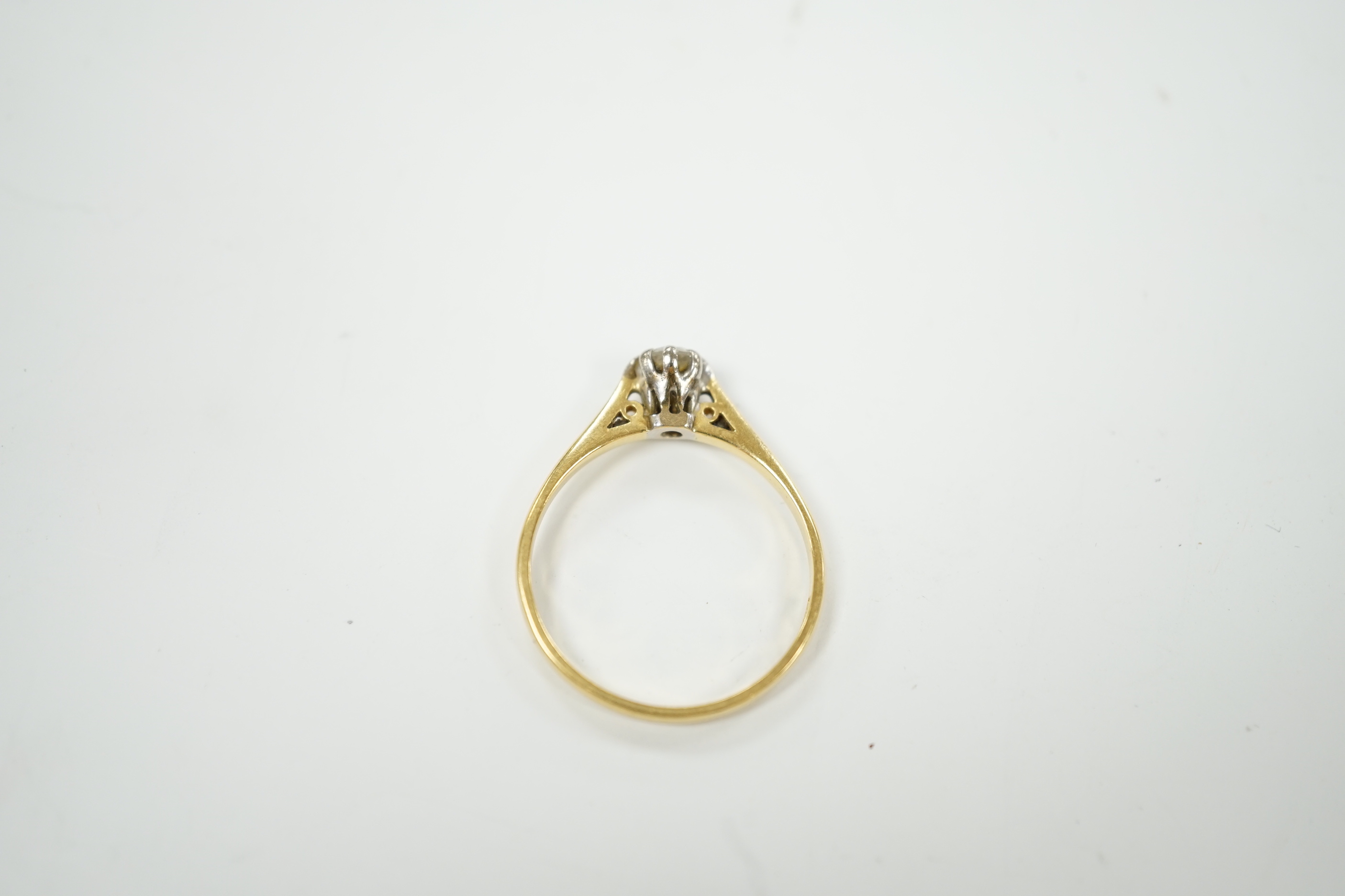 A modern 18ct gold and solitaire diamond set ring, size P/Q, gross weight 2.4 grams, the stone weighing 0.33ct.